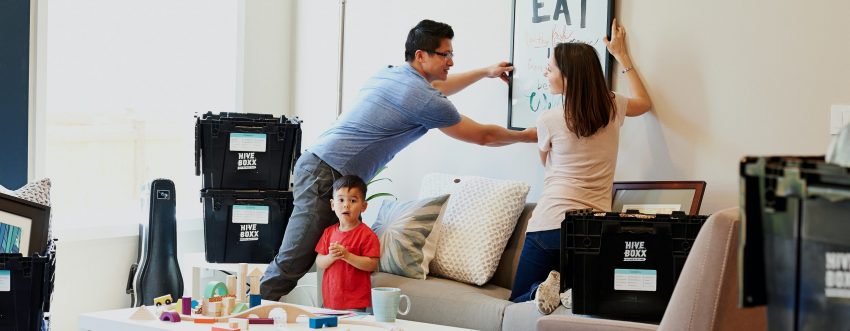 Picture of a family unpacking in their new home.