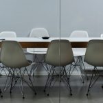 An empty office with a table and chairs
