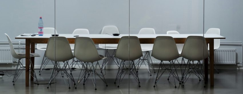 An empty office with a table and chairs